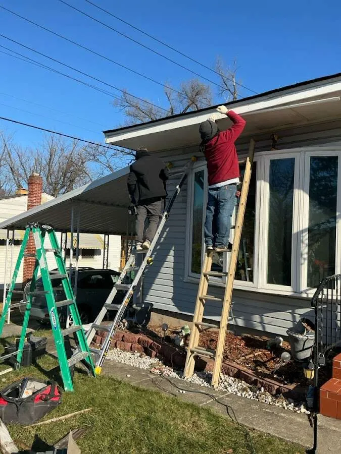 Restoration crew performing exterior repair in Carrollton